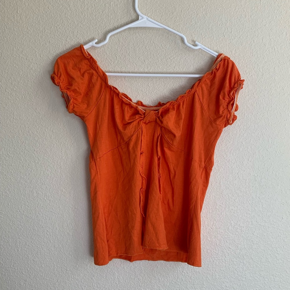 Orange ruffle top